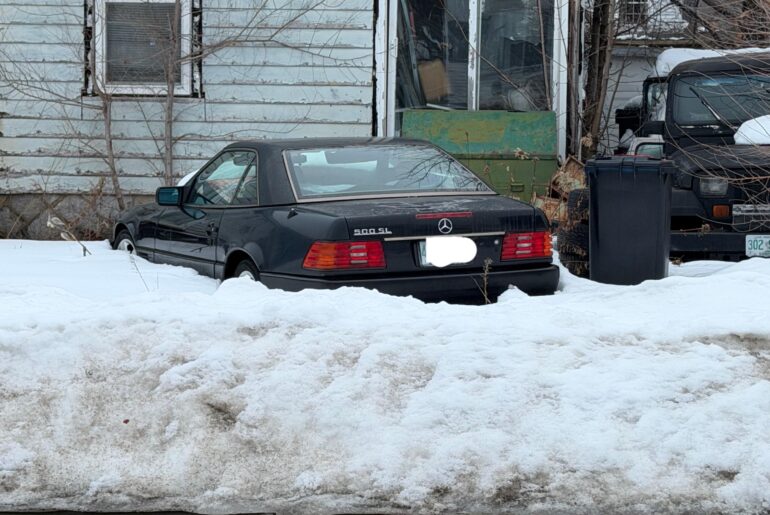 This poor R129 rotting away along with this home in New Hampshire.