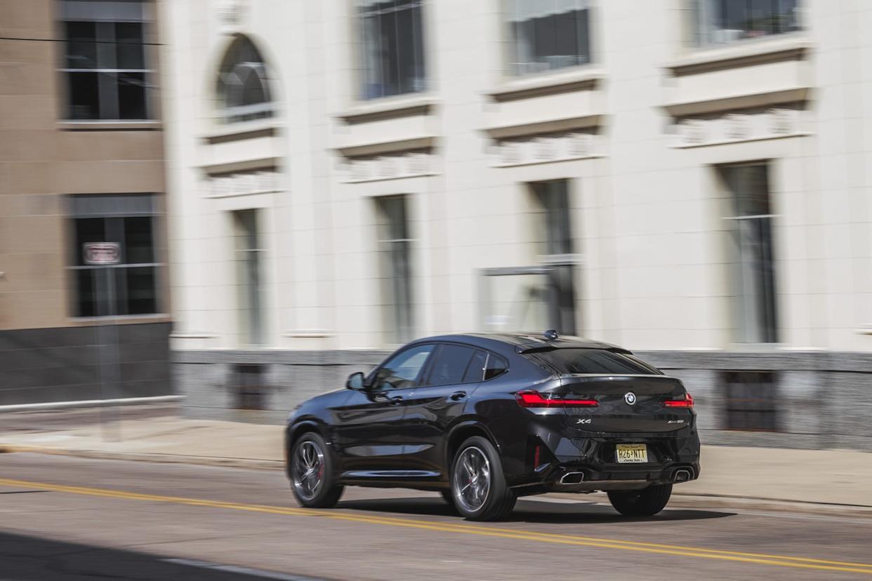 2023 bmw x4 xdrive30i driving downtown