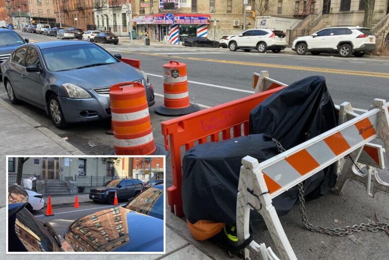 NYC parking wars has drivers saving spots with cones, Con Ed barriers and even derelict e-bikes