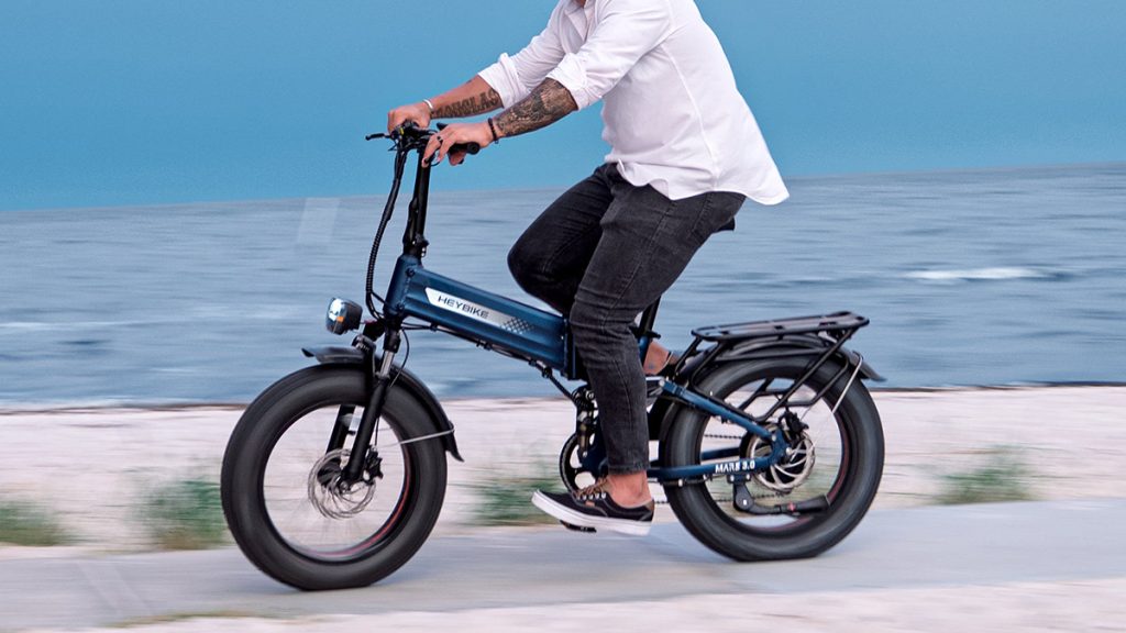 man riding Heybike Mars 2.0 e-bike down coastline