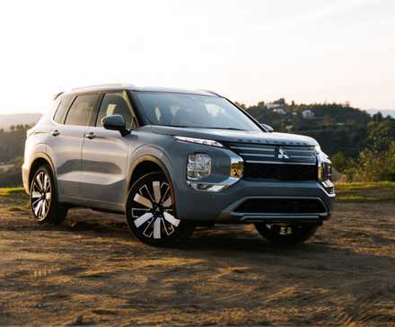 Static front 3/4 shot of a gray 2026 Mitsubishi Outlander.