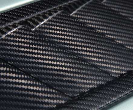 2010 aston martin v12 vantage carbon fiber close up