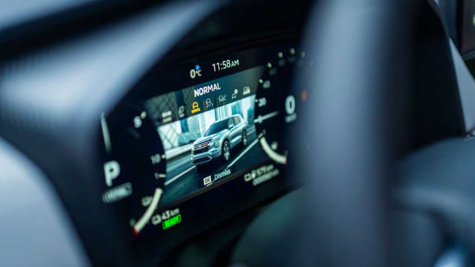 Close-up shot of the digital instrument cluster in a 2026 Mitsubishi Outlander PHEV.