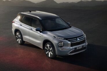 A gray 2026 Mitsubishi Outlander PHEV from a front quarter view overhead.