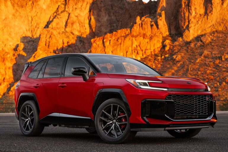 A red 2026 Toyota RAV4 PHEV from a front quarter angle view.