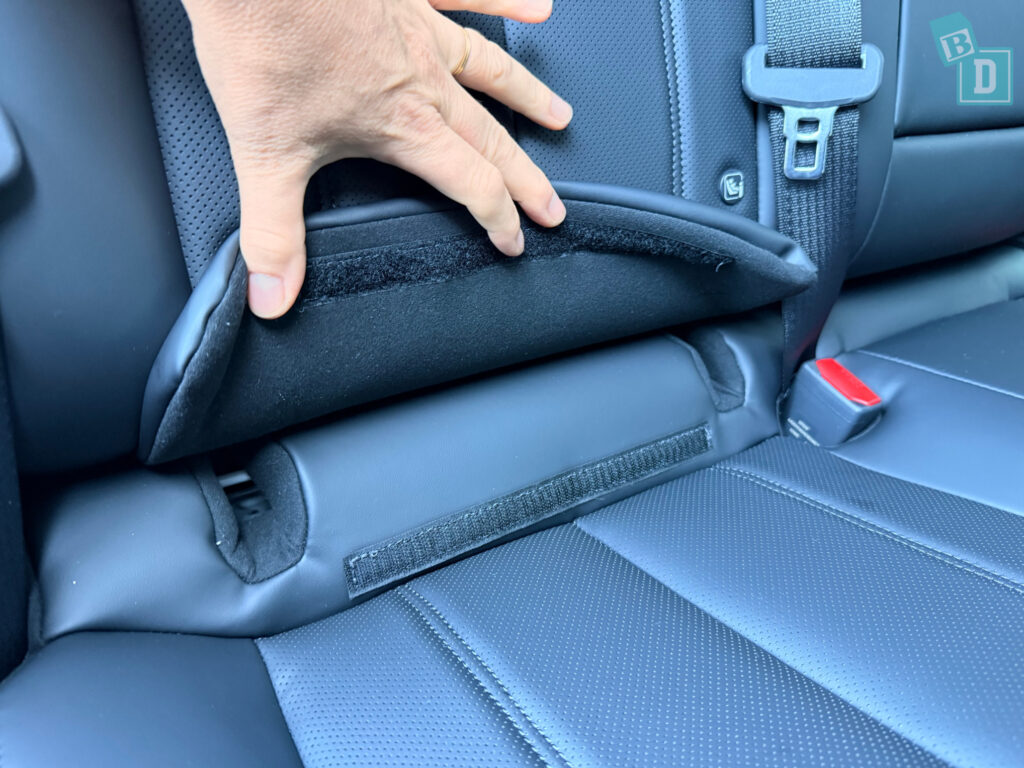 ISOFix connection point close-up under seat fabric