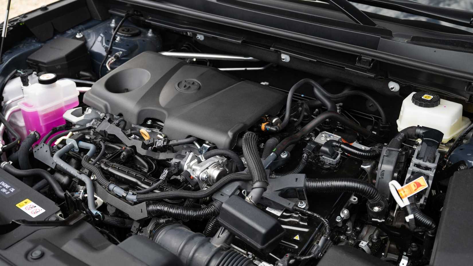Shot of the engine under the hood of a 2026 Toyota RAV4 HEV Limited.