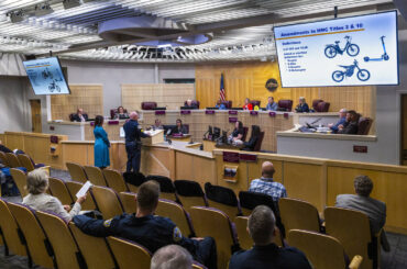 Henderson Police Sgt. Richard Paul with Tory Jackson, the city of Henderson's sustainability an ...