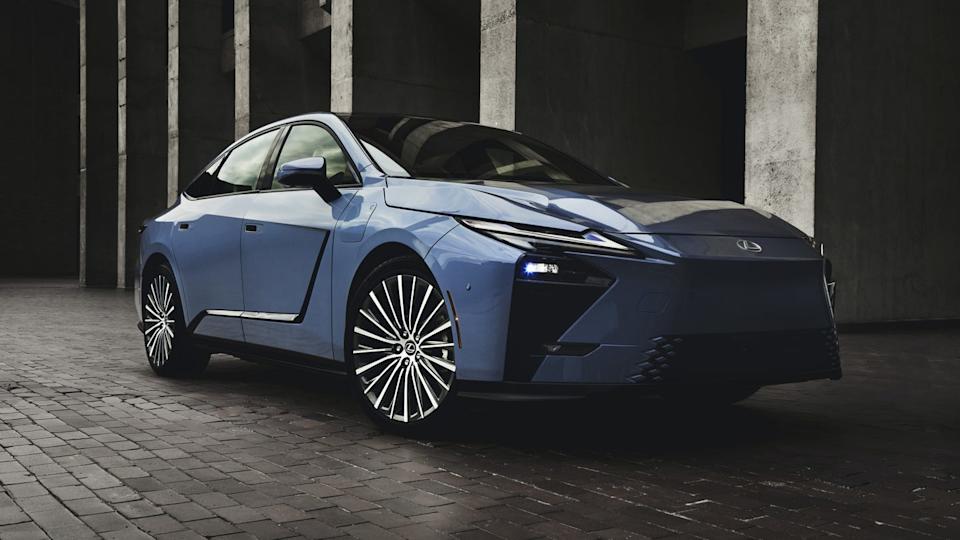 modern blue electric vehicle parked in an industrial setting