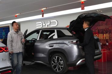 China's BYD sees first profit drop since 2021, even as the Tesla-rival takes global EV crown