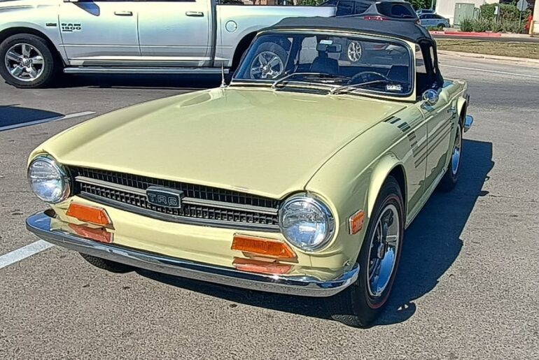 [Triumph TR6] just chillin at H.E.B. in Texas today.