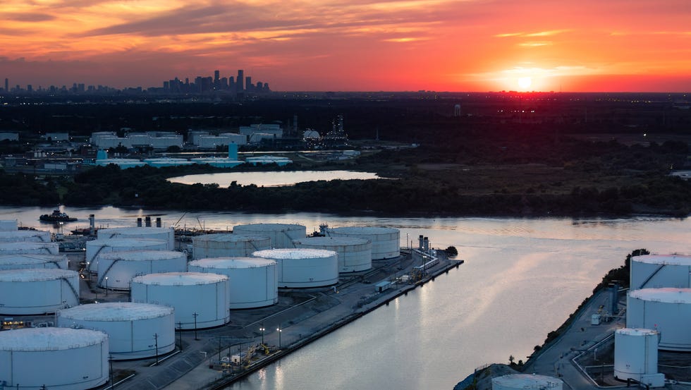 helicopter shot of storage tanks in houston on a warm summer sunset