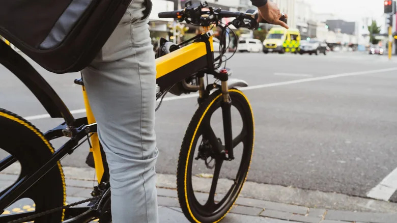 Person riding an e-bike on the road