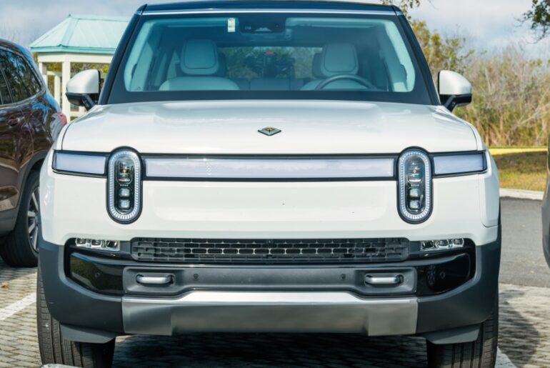 Uber will operate its own robotaxis again—this time with Rivian’s not‑yet‑built EVs