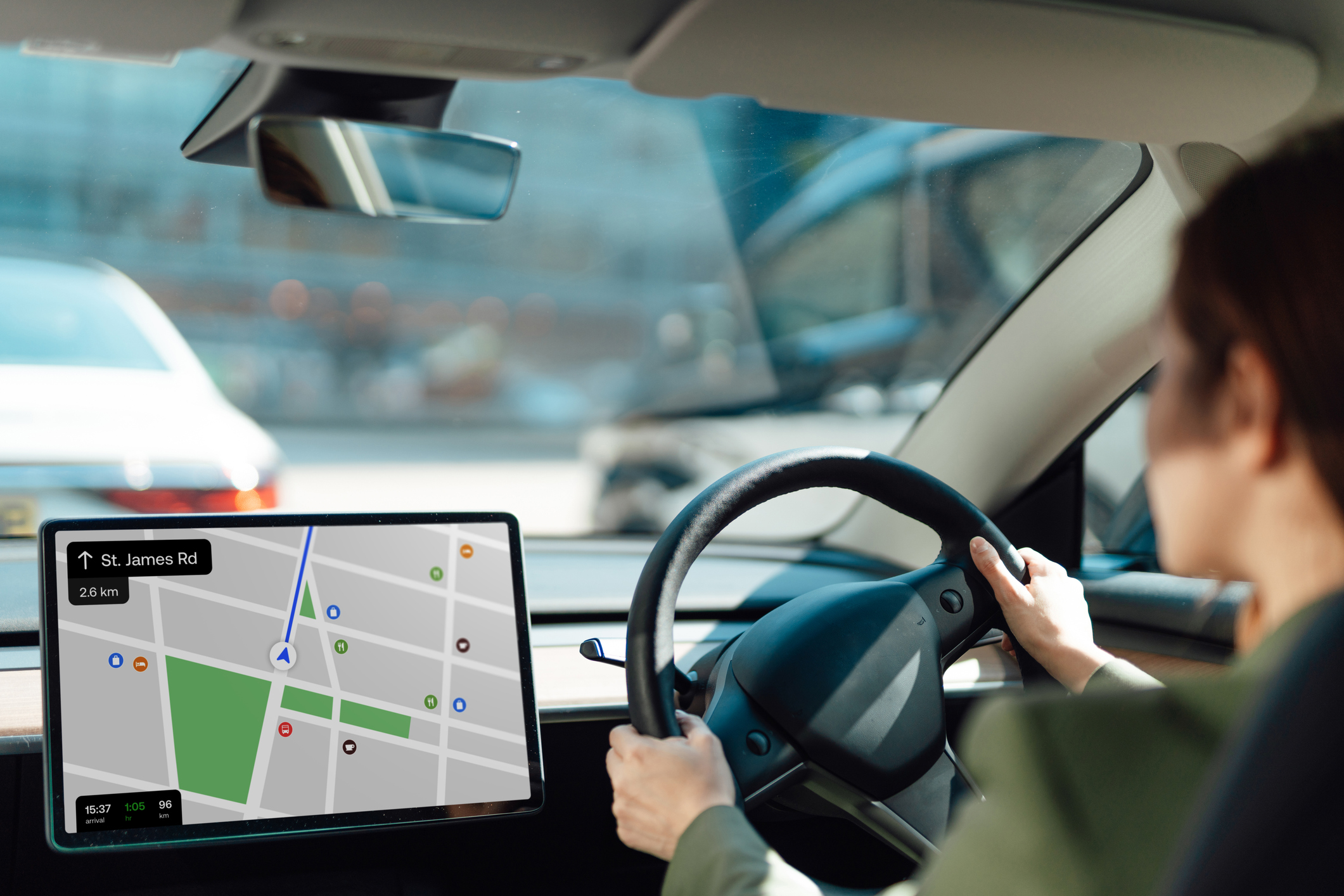 a woman driving her EV