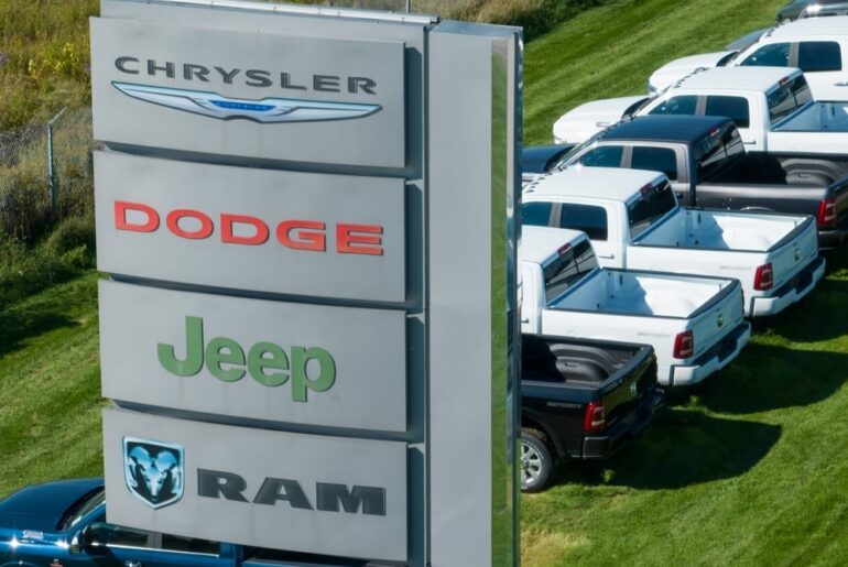 Drive A Tesla To Work Here? This Auto Giant Will Ticket Its Own Employees