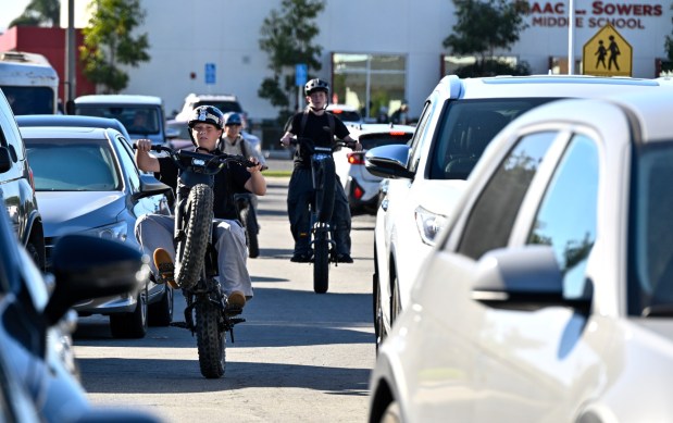A student pops a wheelie while leaving Sowers Middle School on an e-bike in Huntington Beach in February 2026. (Photo by Jeff Gritchen, Orange County Register/SCNG)