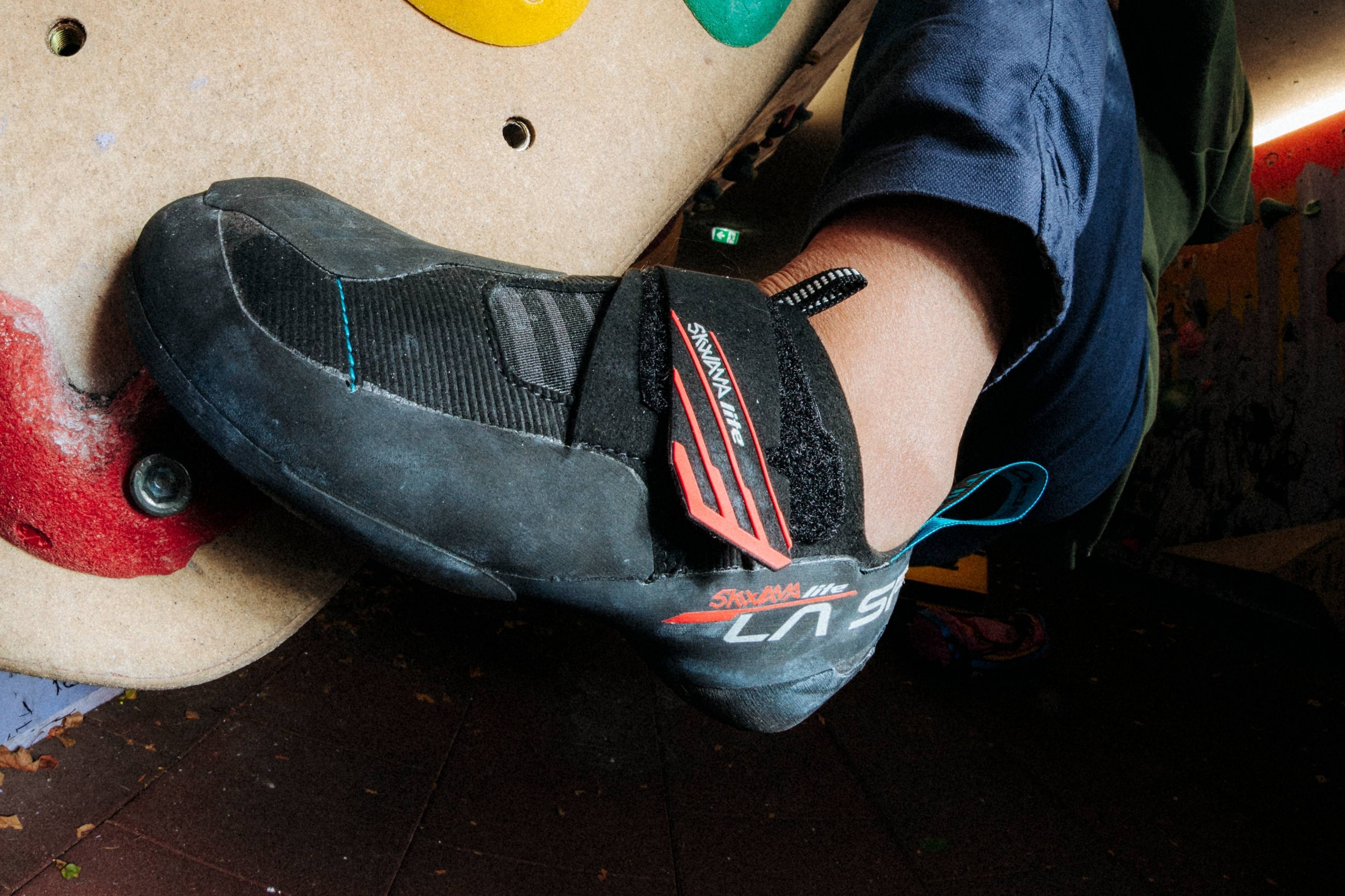 close-up shot of climbing shoe on wall