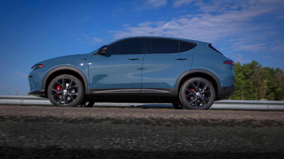 Dynamic side profile shot of a blue 2024 Dodge Hornet.