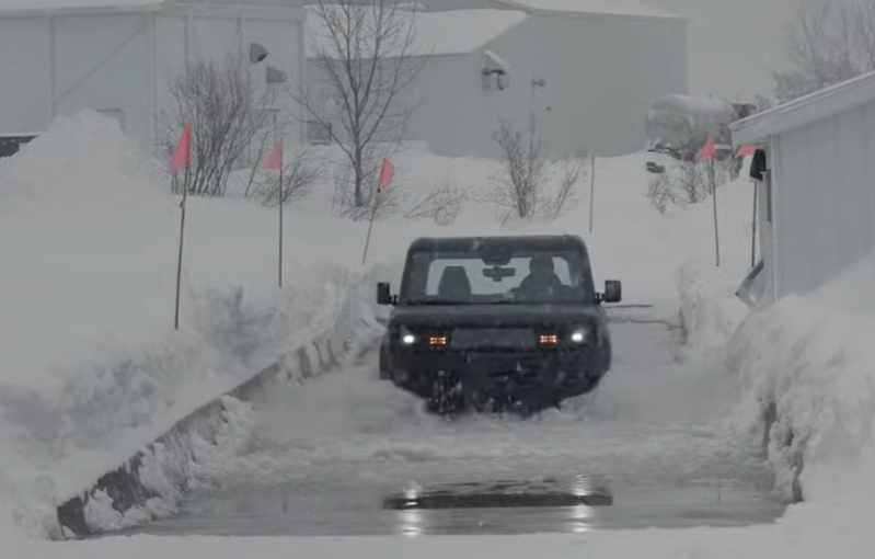 electric vehicle navigating through snowy conditions