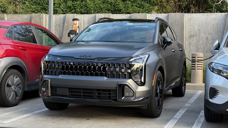 2026 Kia Sportage PHEV at a charging station