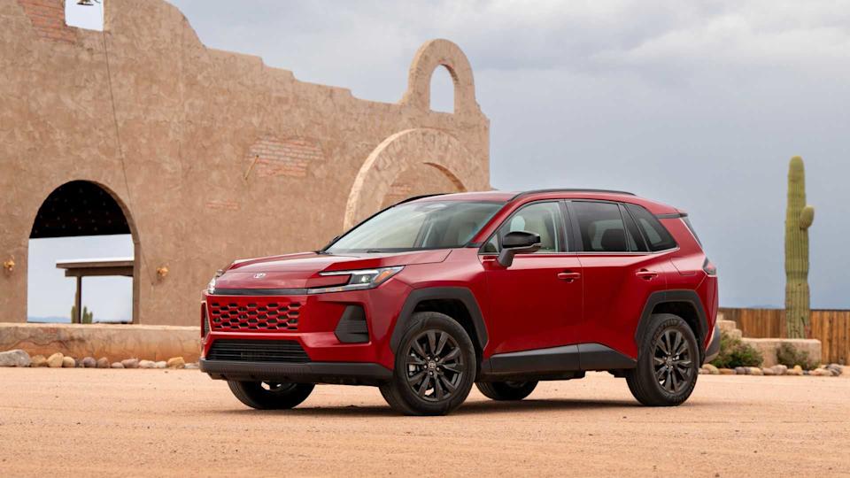 Static front 3/4 shot of a red 2026 Toyota RAV4 HEV XLE Premium.