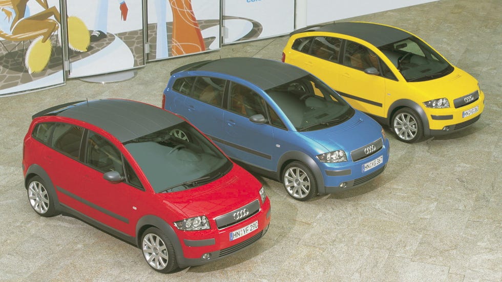 three audi cars in a display setting