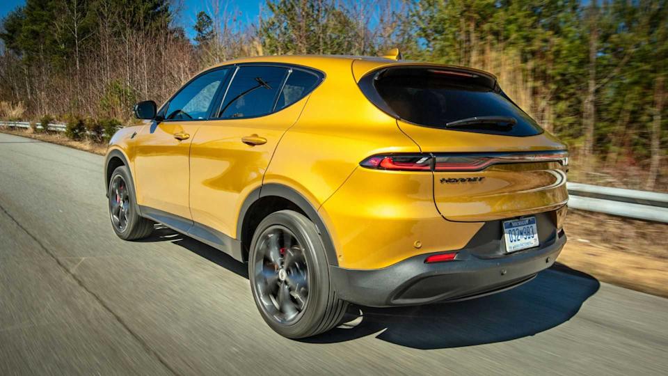 Dynamic rear 3/4 shot of an orange 2024 Dodge Hornet.