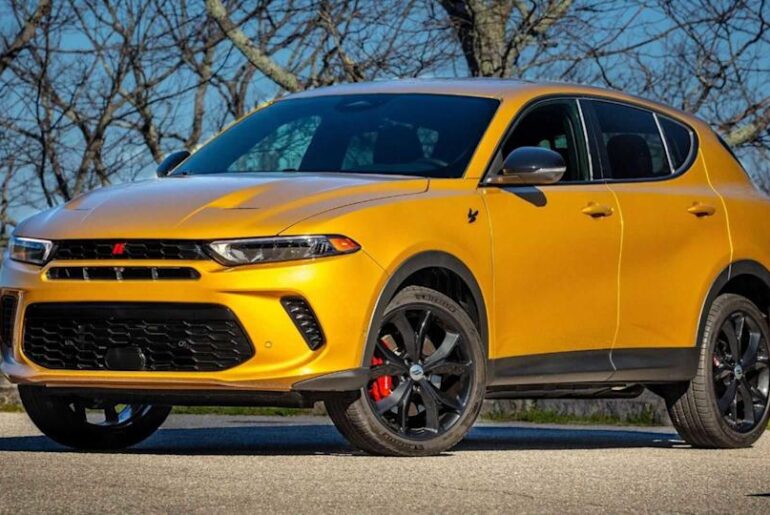 Static front 3/4 shot of an orange 2023 Dodge Hornet.