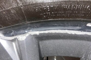 I hit my wheel  tire on the curb side, a piece of the tire rim fell off. Is this still safely drivable?  Knowing there is no vibration, air leak or bulge. I dont see any crack as well and it looks like the tire is still well seated