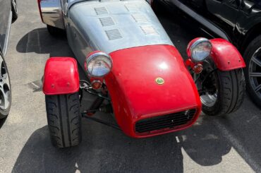 [Caterham?] in a industrial parking lot.
