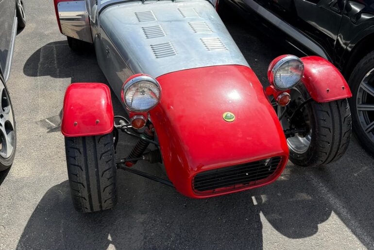 [Caterham?] in a industrial parking lot.