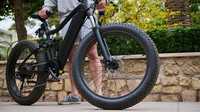 Close up of an e-bike with a person