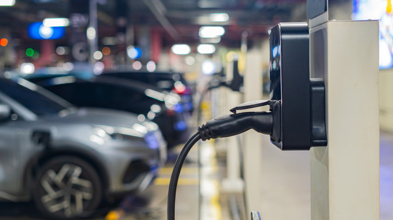 Electric cars being charged on an electric charging station.
