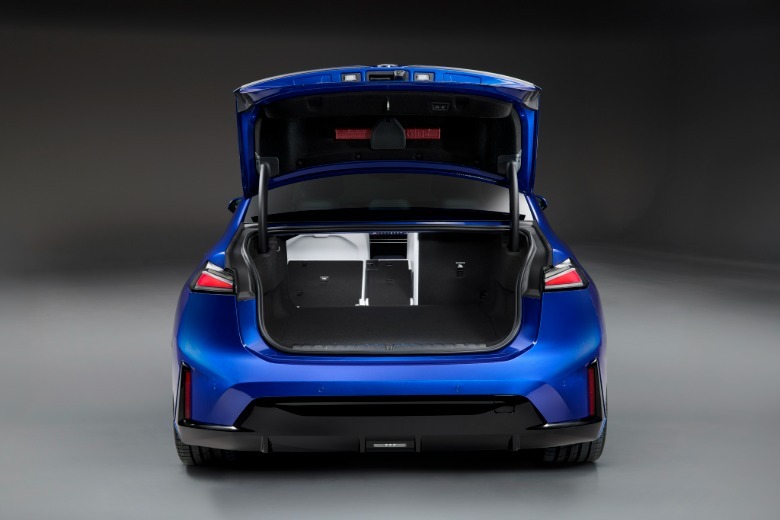 A blue BMW i3 with the trunk open