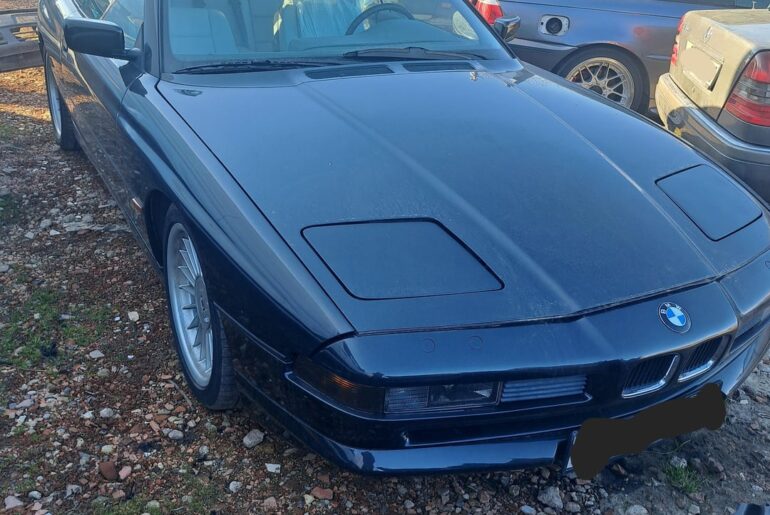 [BMW 850i] rolled in for some suspension work, waiting for parts. 300k km on the clock.