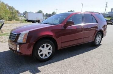 1st generation Cadillac SRX: The official car of sideswiping my neighbour’s Tundra and fleeing the scene.