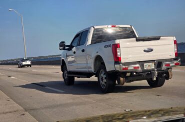 This F250 with what looks to be train wheels on the front and rear.