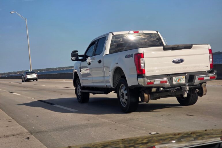 This F250 with what looks to be train wheels on the front and rear.