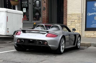 [Porsche Carrera GT] casually parked in the coffee shop lot
