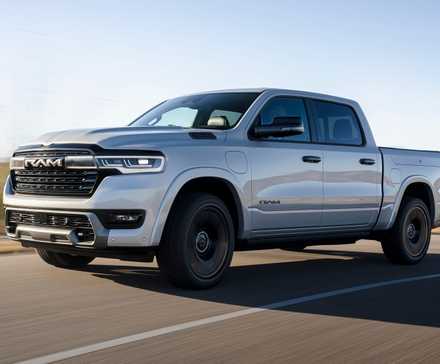 2026 Ram 1500 Ramcharger Silver Front Angled View Driving