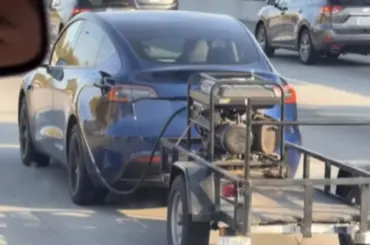A viral clip showing what appeared to be a Tesla owner towing a generator behind his electric car quickly sparked a flood of jokes and discussions about range anxiety online.
