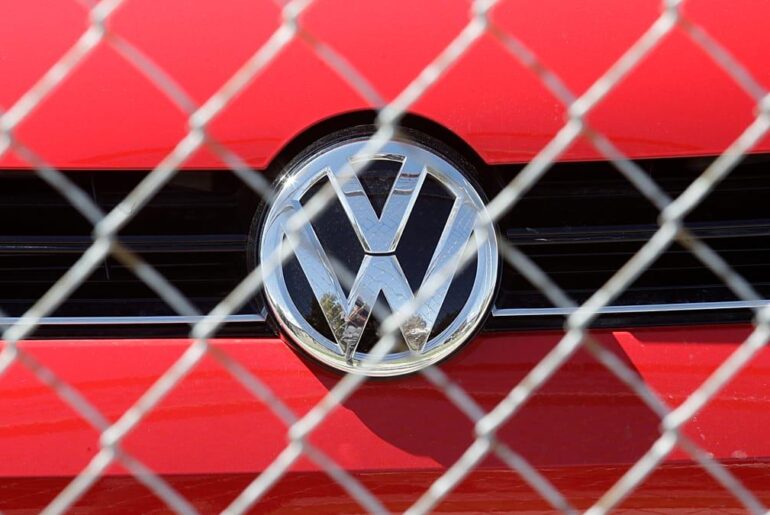 Volkswagen slashes 50,000 jobs after profits collapse by nearly half
