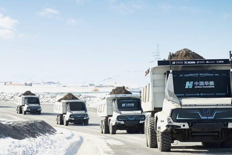 100 autonomous electric haul trucks with 5-minute automated battery swapping just finished a year of testing in extreme cold—and they're outperforming diesel