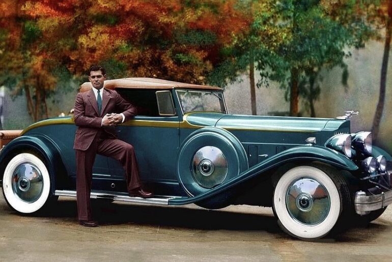 A young Clark Gable with the fruits of his success; a 1932 Packard Twin-6 905 Roadster that received many careful updates from coachbuilder Bohman & Schwartz to suit the actor's refined tastes. In the 1950s it was found derelict in a rural California backyard and purchased for $75.