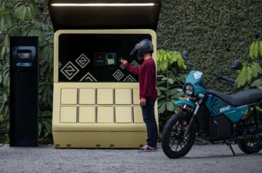 A man swaps batteries for an electric motorbike.