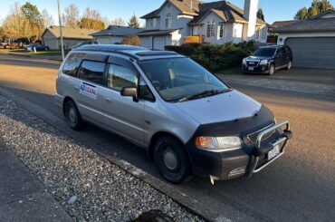 Right-hand-drive 1st gen [Honda Odyssey] being used as a USPS van