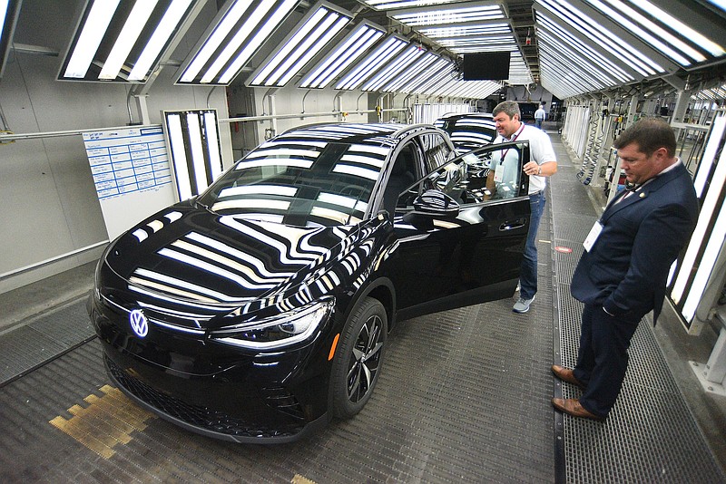 Staff file photo by Matt Hamilton / In 2022, visitors get a chance to look over the new vehicles during the launch celebration for the Volkswagen ID.4 electric SUV at the Chattanooga Volkswagen Assembly Plant.