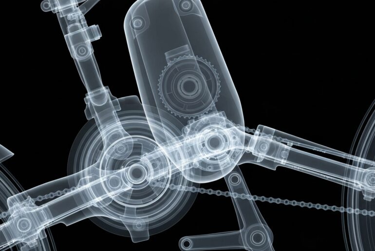 An extreme close-up X-ray image revealing the intricate internal components of an electric bicycle, including the motor, gears, and frame, conceptually illustrating the technological complexity and power behind these vehicles.