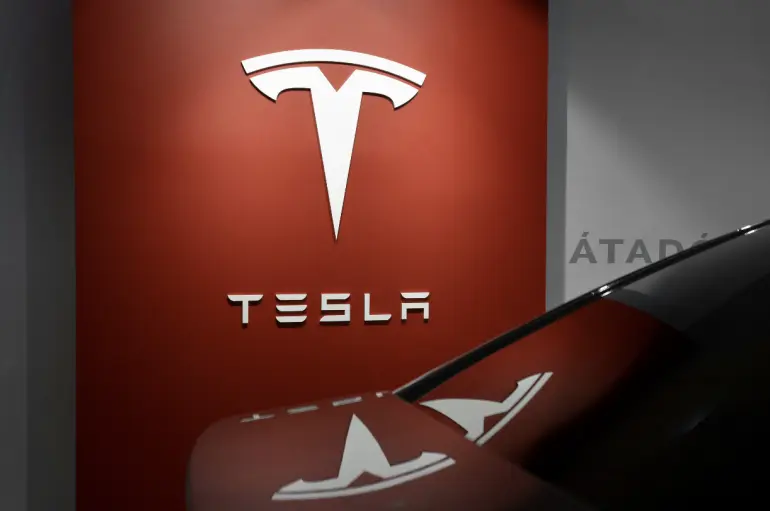 Tesla tops global electric car sales again